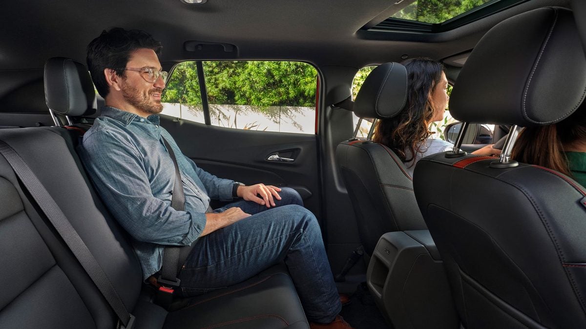 Adult passenger sitting in the back seat of a 2026 Chevrolet Trax