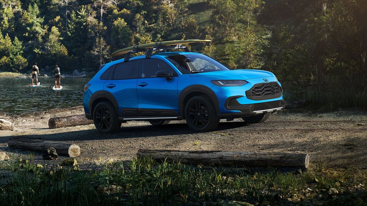 Honda HR-V Sport in Boost Blue Pearl parked beside a lake